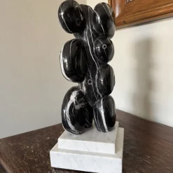 Abbracci Veined Black Marble Sculpture on White Base by Piero Speranza