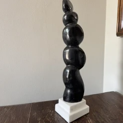 Presenza Invisibile Black Marquina Marble Sculpture on White Base by Piero Speranza