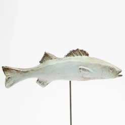 Slim white seabass sculpture